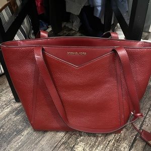 Red Michael Kors handbag